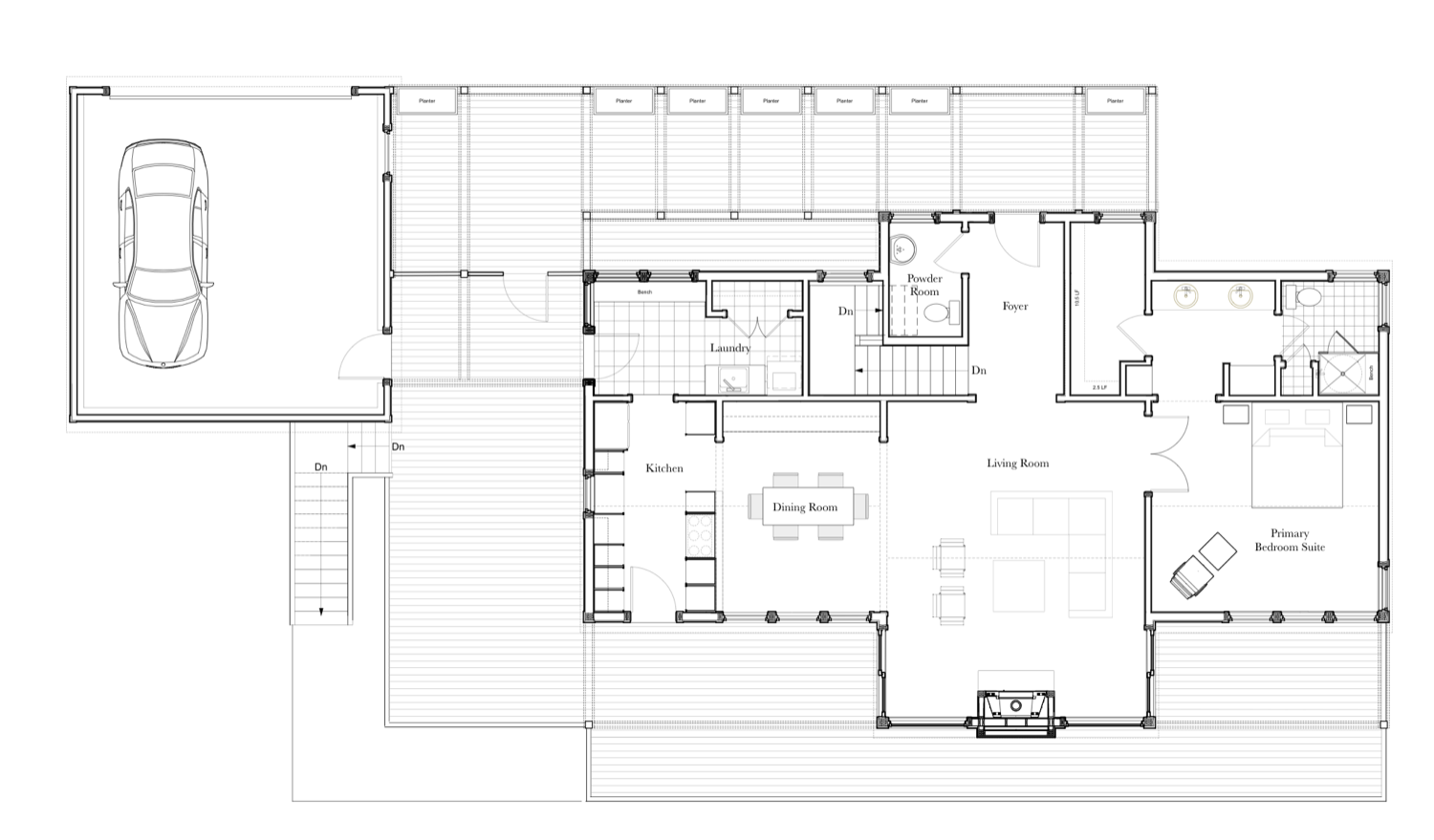 First floor plan: garage and entry to the left, then kitchen, dining and living rooms running into a primary bedroom suite, with decks along the outer edge.
