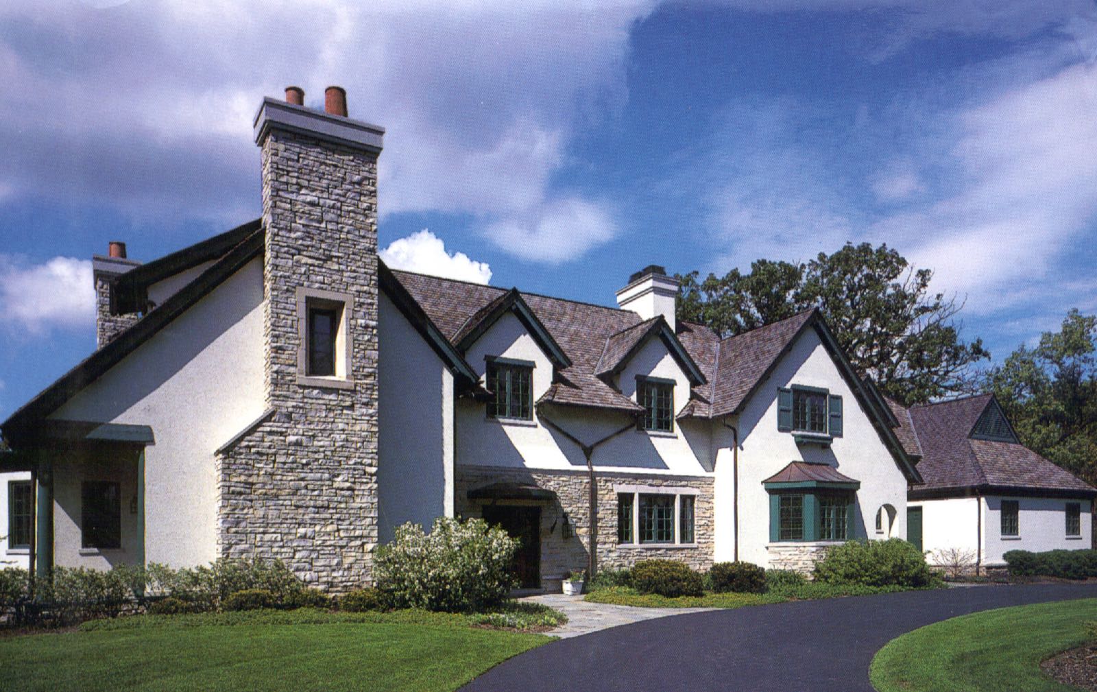 The house seen from the south, showing the length of the principal elevation across the garden front.